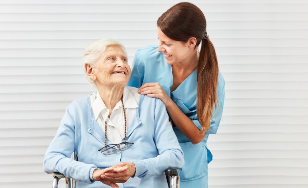 Elderly woman with her nurse