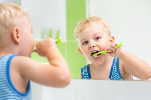 Child brushing his teeth