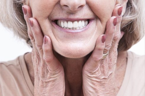 old woman showing her teeth