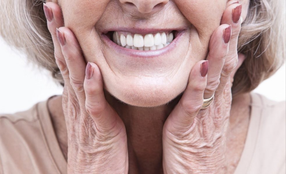 old woman showing her teeth
