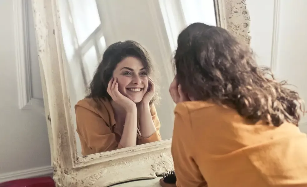 Photo of Woman Looking at the Mirror