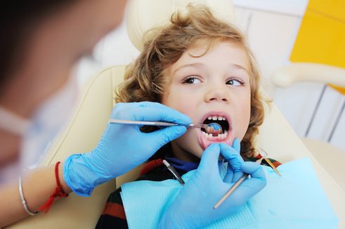 a kid having a dental check up