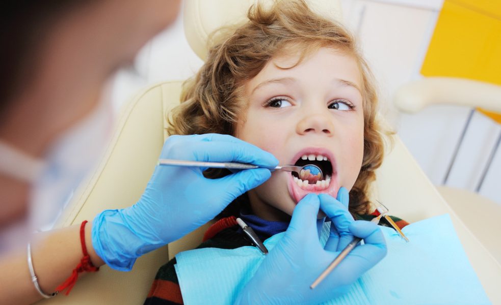 a kid having a dental check up